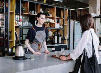 A bustling café with customers enjoying their drinks, representing strategies to boost sales in a café business.