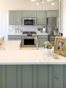 Robin blue accents in a light and bright kitchen space, creating a cheerful and inviting atmosphere. The soft blue hue enhances the overall brightness of the room.