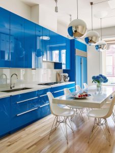 Yves Klein blue kitchen island, showcasing a bold and vibrant hue that serves as a striking centerpiece in the kitchen. The rich blue color adds a modern and artistic touch.