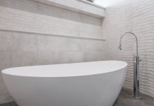 Tranquil Zen-inspired bathroom with natural elements, soft lighting, and minimalistic decor.