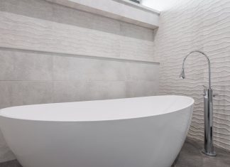 Tranquil Zen-inspired bathroom with natural elements, soft lighting, and minimalistic decor.